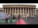 Environmental activists splash green paint outside venue of summit for new global finance pact