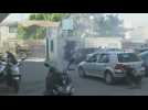 Palestinians hurl stones at passing Israeli military vehicles during Jenin raid