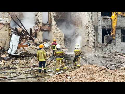 Ukrainian rescuers at scene in Mykolaiv after Russian strike