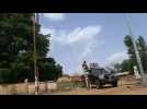 Military outside Niger's national television station and president still detained