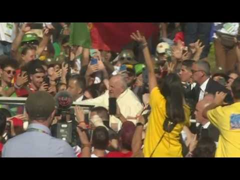 Crowds of pilgrims cheer Pope Francis at World Youth Day in Lisbon