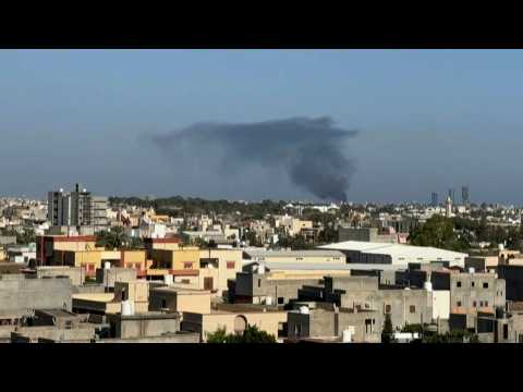 Libya: Smoke billows following overnight clashes between militants in Tripoli