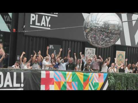 Fans in London cheer after England scores third goal against Australia in WWC semi-final