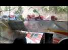 Mexico police and volunteers pull bus back upright after crash kills at least 27