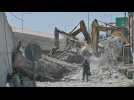 Firefighters search through rubble after bridge collapse in Greece