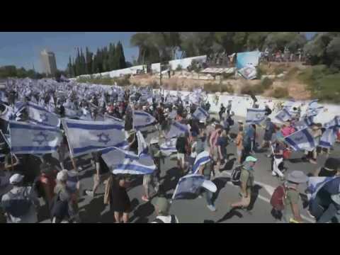 Israelis flock to streets after MPs approved key judicial reform clause