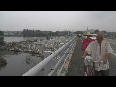 Beijing park engulfed in floodwater and plastic waste