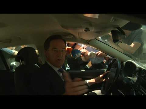 Dutch PM Mark Rutte departs Hague palace after presenting resignation to the king