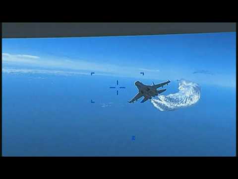 Images show two Russian jets 'intercepting' a US Air Force drone over the Black Sea