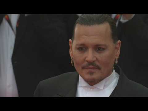Johnny Depp receives warm welcome as comeback film opens Cannes