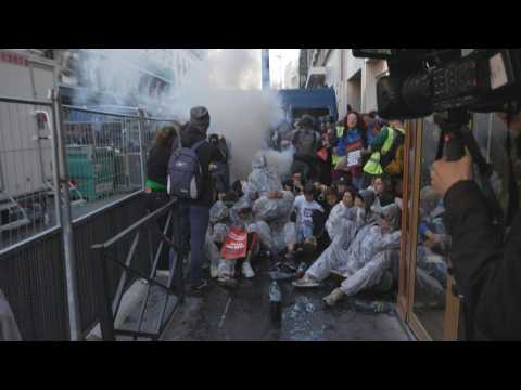 Paris police fire tear gas on protesters at oil giant's meeting