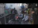 Paris police fire tear gas on protesters at oil giant's meeting