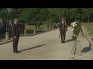 Macron takes part in a ceremony in Bratislava before leaving for Moldova