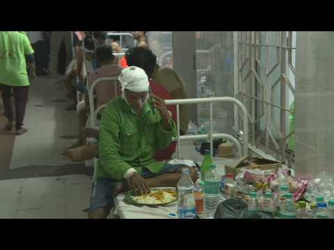 Railway disaster in India: images of the injured being treated in hospital