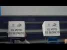 Ecuadorians cast their votes as polls open