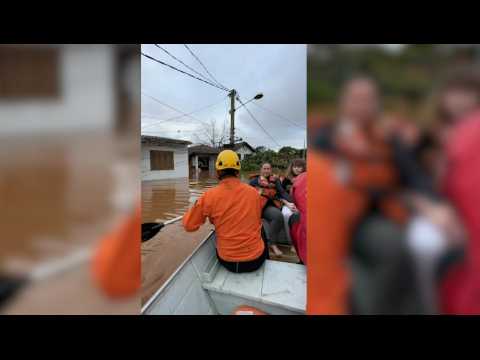 Brazil firefighters rescue people trapped by floods as heavy rains leave 21 dead