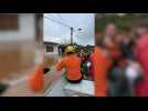 Brazil firefighters rescue people trapped by floods as heavy rains leave 21 dead