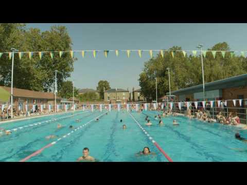 London residents cool down at an outdoor swimming pool amid heat wave