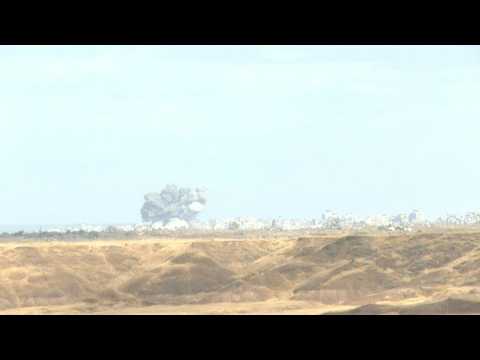 Smoke rises following a strike in the central Gaza Strip