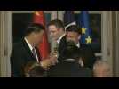 Macron and Xi toast at a state dinner at the Elysee Palace