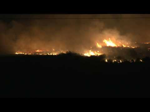 Fires rage after Lebanon's Hezbollah rained rockets on northern Israel