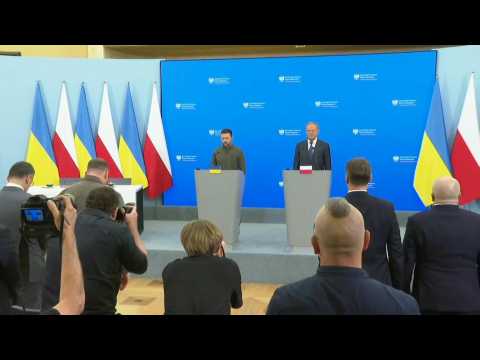 Zelensky, Tusk sign security deal, hold minute's silence for Russian strike victims