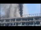 Smoke rises from damaged buildings in Kyiv after Russian attacks