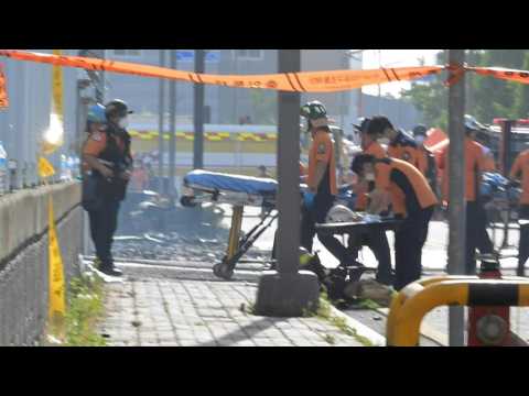 Rescue workers at scene of deadly South Korea factory fire