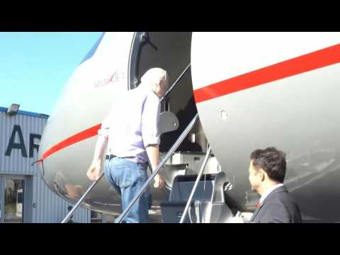 Wikileaks video shows Julian Assange boarding flight in London