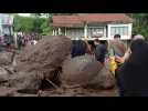 Indonesians inspect damage from deadly flash floods