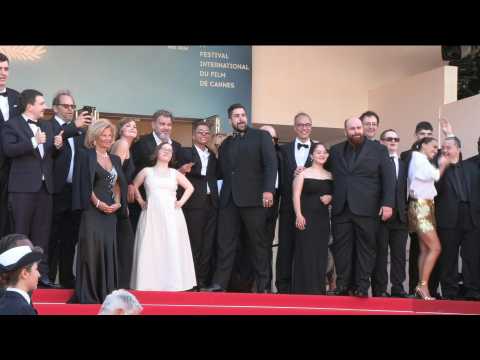 Artus on the red carpet with cast of his hit film "Un p'tit truc en plus"