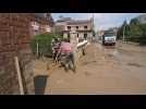 Northern France residents clear streets after mudslides